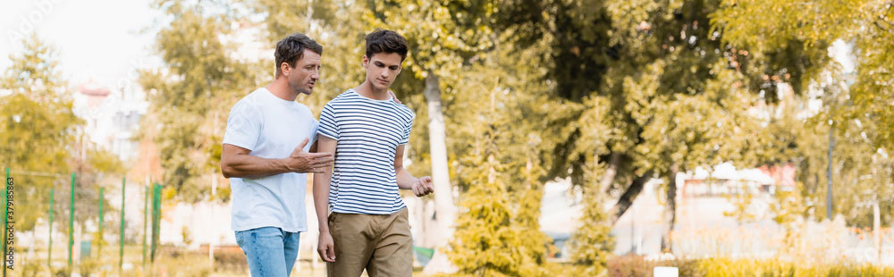 Father and son walking and talking